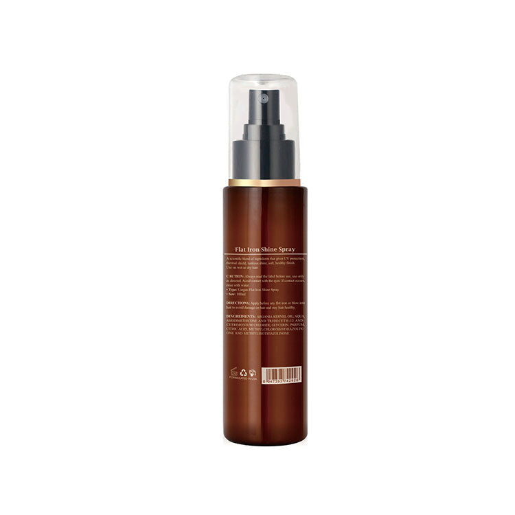 Spray per capelli in flacone marrone con erogatore nero, etichetta posteriore visibile. Prodotto per lucentezza e protezione termica.