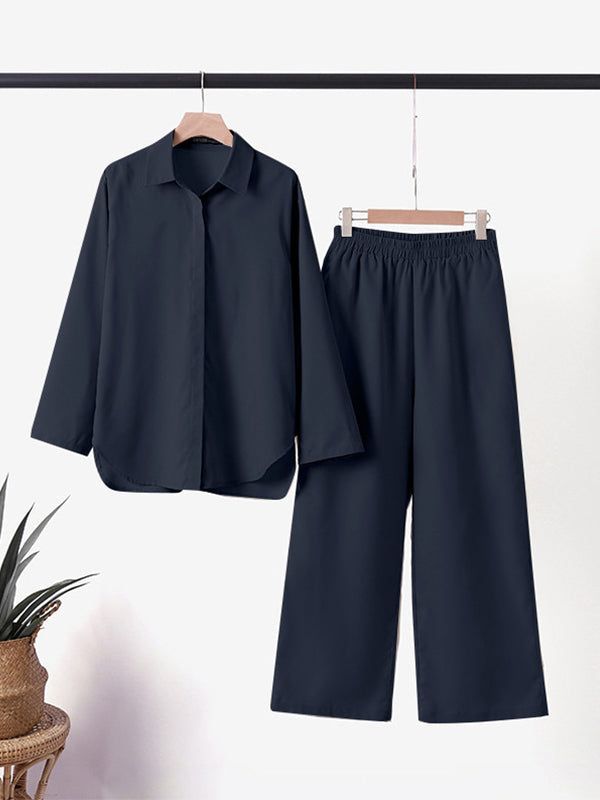 Completo pigiama donna nero, camicia maniche lunghe e pantaloni larghi, tessuto morbido, elegante e confortevole, ideale per la notte.