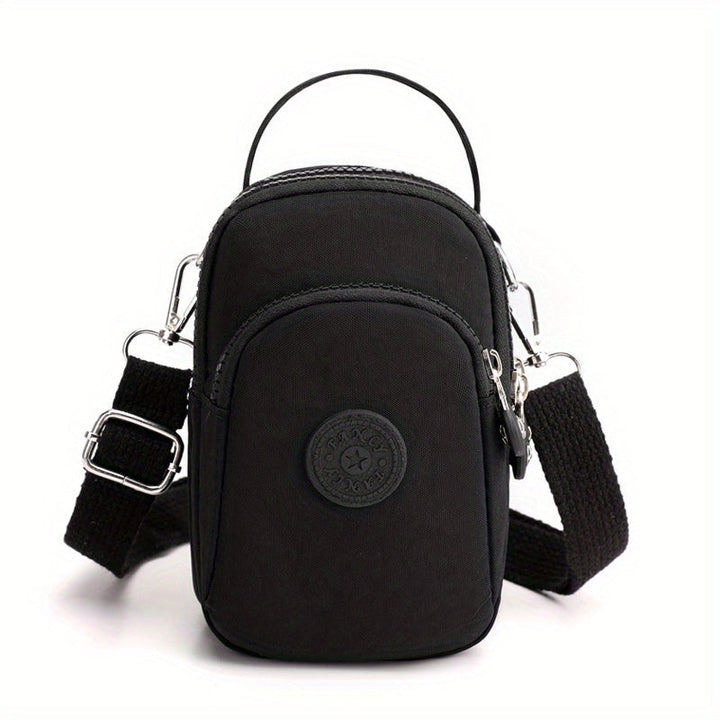 Borsa a tracolla nera in nylon, compatta e resistente, con tasche multiple e cinturino regolabile. Ideale per viaggi e uso quotidiano.