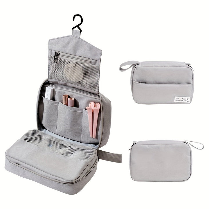 Borsa da toilette grigia con gancio, tasche multiple e chiusura a zip, ideale per viaggi. Organizzatore cosmetici compatto e resistente all'acqua.