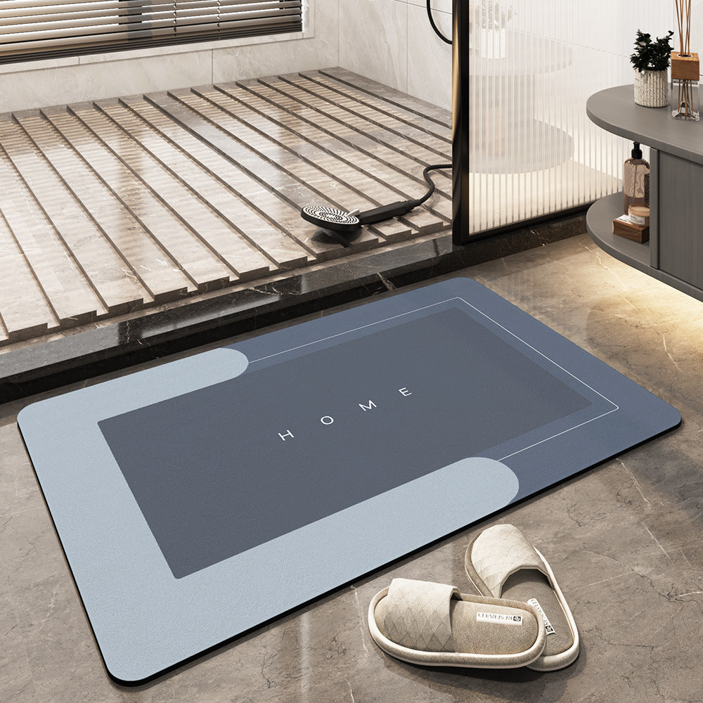 Tappeto da bagno antiscivolo grigio con scritta "HOME", design moderno, adatto per doccia, pavimento in marmo, include pantofole beige.