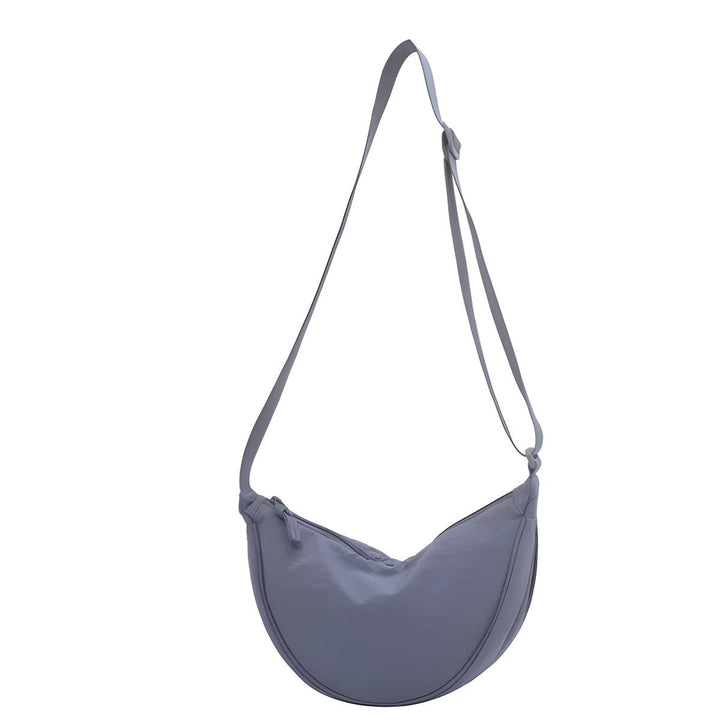 Borsa a tracolla grigia in tessuto, design minimalista, regolabile, ideale per uso quotidiano. Accessorio moda donna, stile casual ed elegante.
