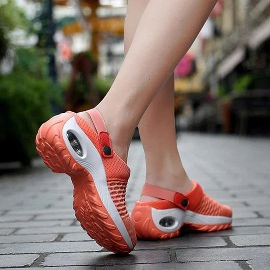 Scarpe da ginnastica arancioni da donna, suola ammortizzata, design traspirante, ideali per camminata su strada, comfort e stile moderno.