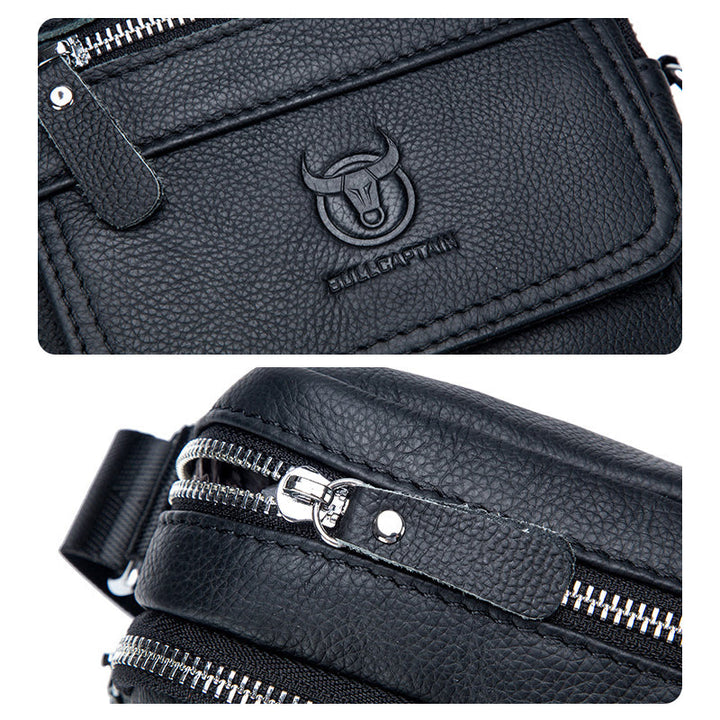Borsa a tracolla in pelle nera con logo toro, doppia cerniera argentata, design elegante e resistente. Accessorio moda uomo, alta qualità.
