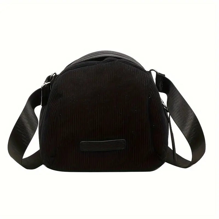 Borsa a tracolla nera in tessuto a coste, design moderno, chiusura con zip, ideale per uso quotidiano. Accessorio moda donna elegante e pratico.