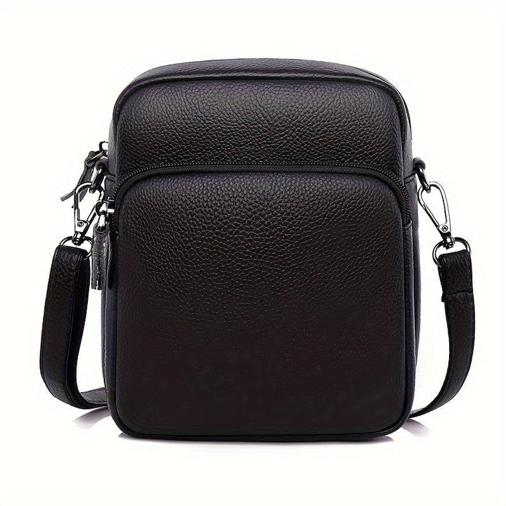 Borsa a tracolla in pelle nera da uomo, design elegante e compatto, con tasca frontale e chiusura a zip, ideale per uso quotidiano e viaggi.