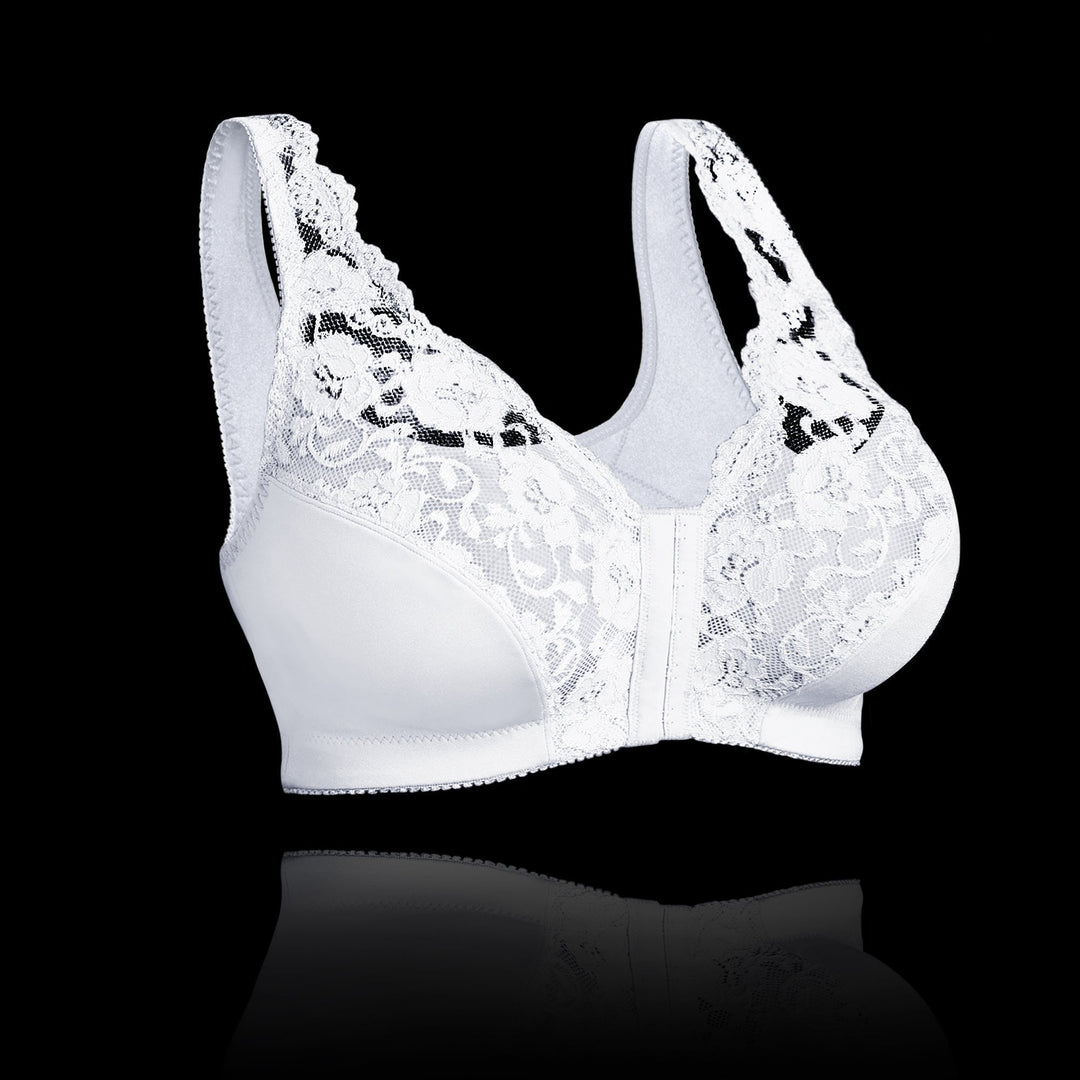 Reggiseno bianco in pizzo floreale, senza ferretto, su sfondo nero. Intimo femminile elegante, comfort e supporto.