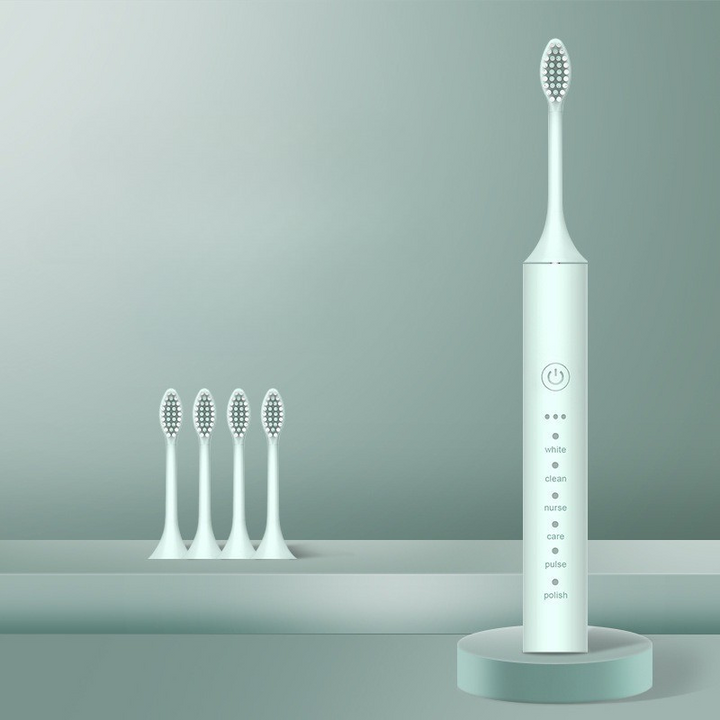Spazzolino elettrico bianco con base di ricarica e quattro testine di ricambio, design moderno, ideale per igiene orale avanzata e pulizia dentale.