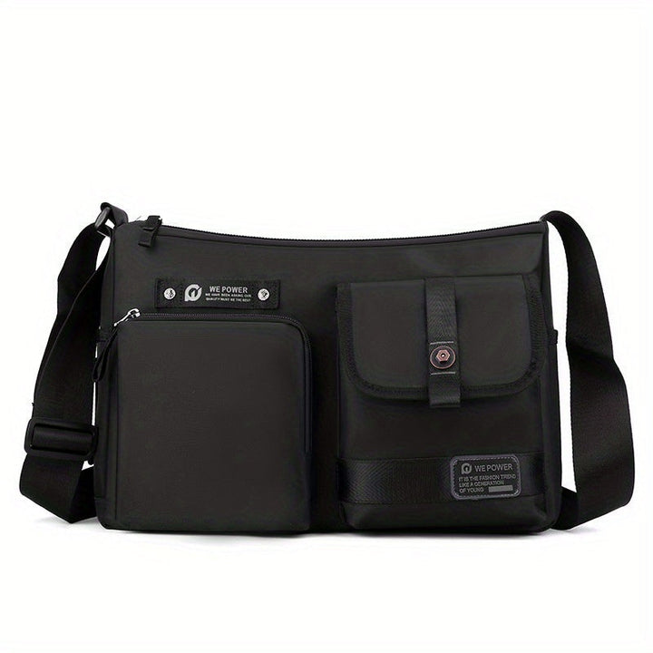 Borsa a tracolla nera unisex, design moderno con tasche multiple, chiusura zip, ideale per viaggio e uso quotidiano. Materiale resistente e leggero.