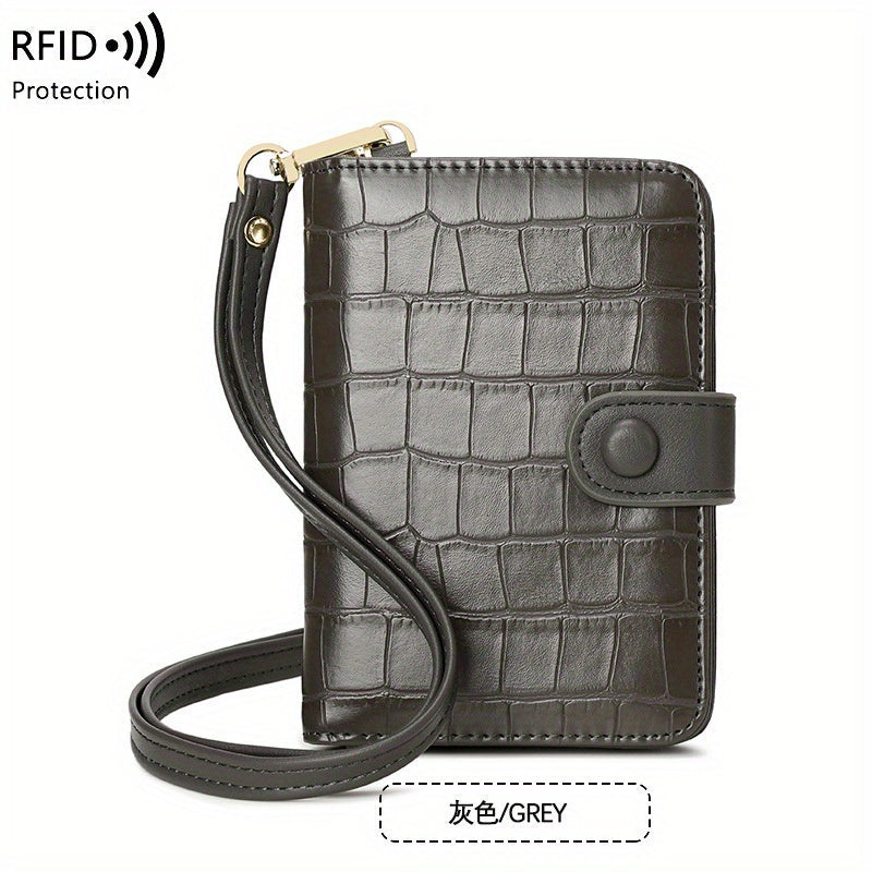 Portafoglio in pelle marrone con texture coccodrillo, cinturino da polso e protezione RFID. Design elegante e funzionale per sicurezza e stile.