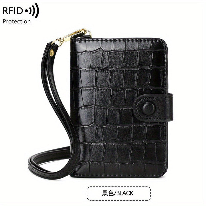 Portafoglio nero in pelle con texture coccodrillo, protezione RFID, cinturino da polso, chiusura a bottone. Elegante e sicuro per carte e contanti.