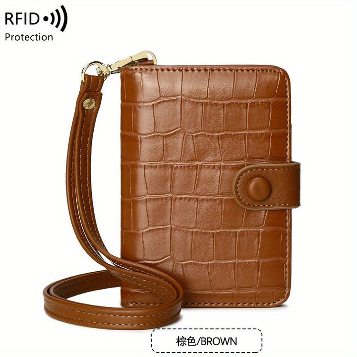 Portafoglio in pelle marrone con texture coccodrillo, cinturino da polso e protezione RFID. Elegante e sicuro per carte e contanti.