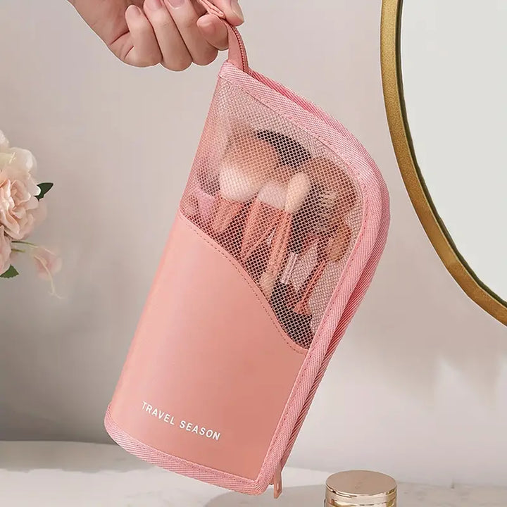 Astuccio da viaggio rosa per trucchi con pennelli, design a rete, ideale per organizzare cosmetici. Accessorio essenziale per il make-up.