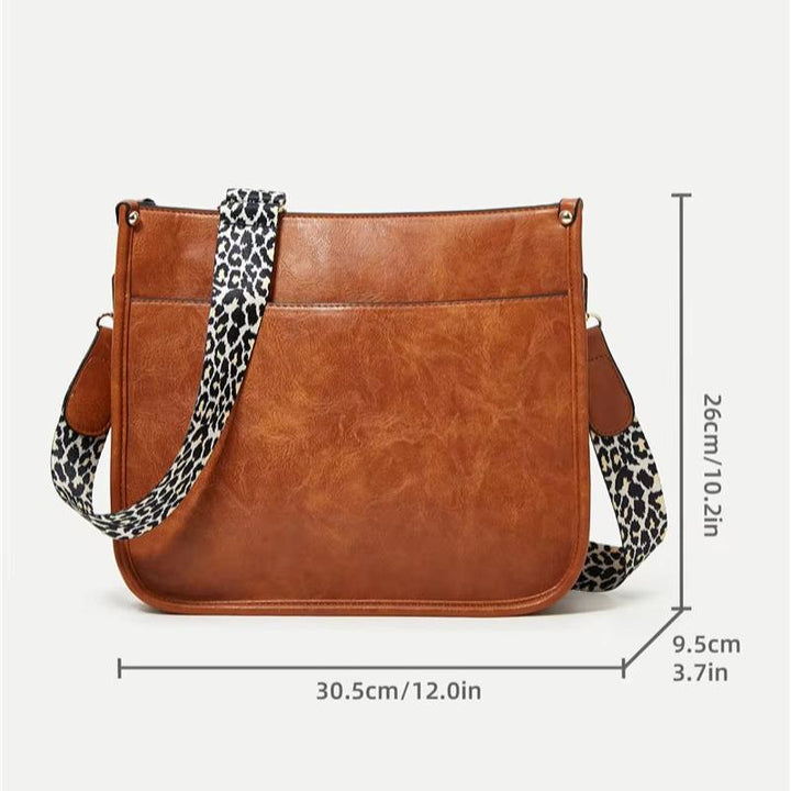 Borsa a tracolla in pelle marrone con cinturino leopardato, dimensioni 30,5x26x9,5 cm. Elegante accessorio moda donna, perfetto per ogni occasione.