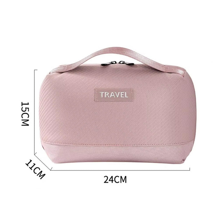 Borsa da viaggio rosa, dimensioni 24x15x11 cm, con manico superiore e chiusura a zip. Ideale per organizzare accessori da viaggio.
