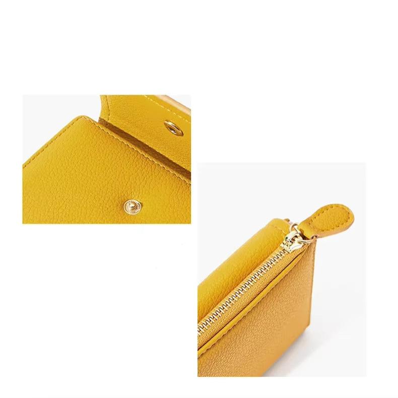 Portafoglio in pelle gialla con chiusura a zip e bottone, design elegante e compatto, accessorio moda donna, ideale per organizzare carte e contanti.