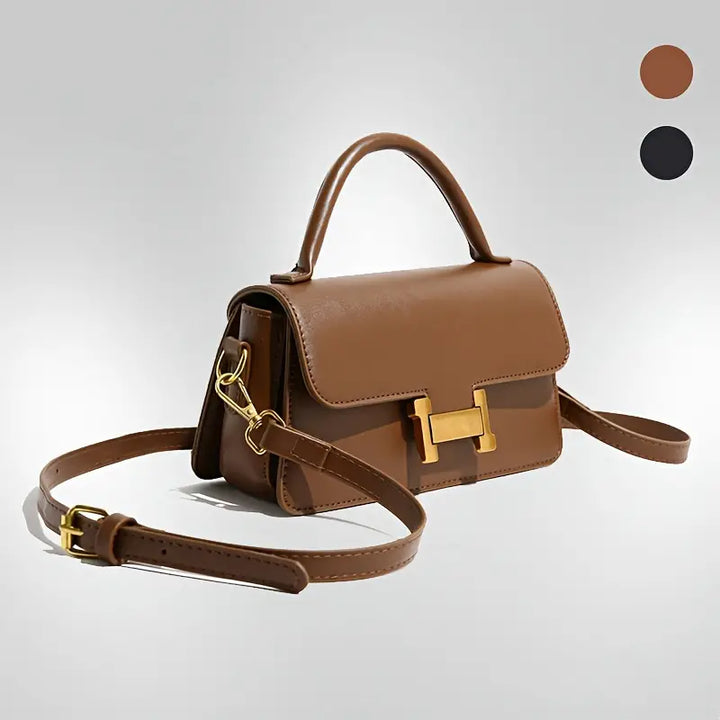 Borsa a tracolla in pelle marrone con chiusura dorata, design elegante e manico superiore. Disponibile in marrone e nero. Accessorio moda donna.