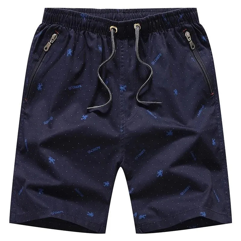 Pantaloncini uomo blu scuro con tasche con zip, motivo a pois e coulisse. Ideali per sport e tempo libero. Tessuto leggero e traspirante.