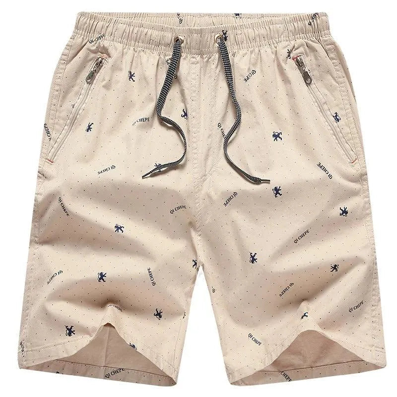 Pantaloncini beige da uomo con stampa a fantasia, tasche con zip, coulisse nera. Ideali per l'estate, moda casual, comodi e leggeri.