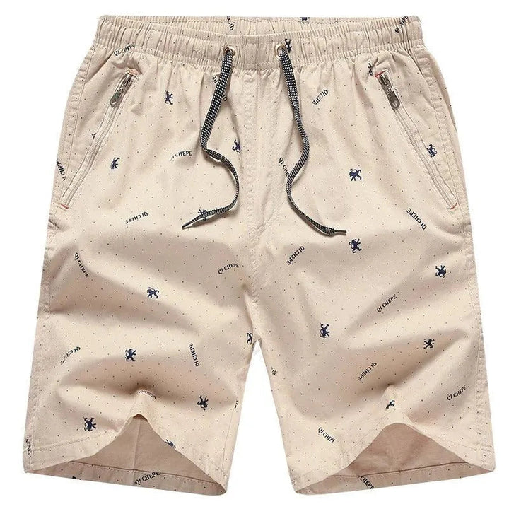 Pantaloncini beige da uomo con stampa a fantasia, tasche con zip, coulisse nera. Ideali per l'estate, moda casual, comodi e leggeri.