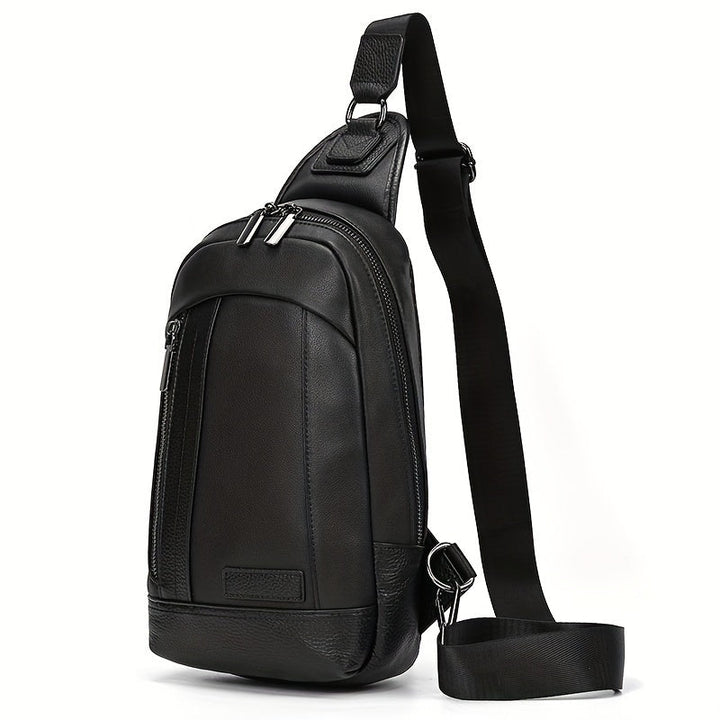 Zaino monospalla in pelle nera, design elegante e moderno, con cerniere multiple e tracolla regolabile. Ideale per uomo, moda e praticità.