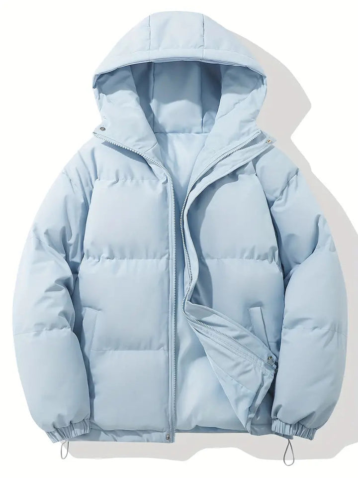 Giacca invernale imbottita azzurra con cappuccio, chiusura a zip, tasche laterali. Perfetta per il freddo, moda uomo e donna.