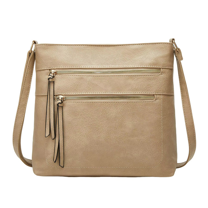 Borsa a tracolla beige in pelle sintetica con doppie tasche frontali con cerniera, design elegante e moderno, ideale per donna.