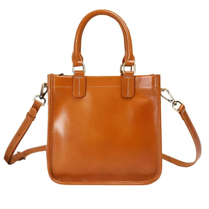 Borsa a mano in pelle marrone, design elegante con tracolla regolabile e manici robusti. Perfetta per moda donna, accessori di lusso.