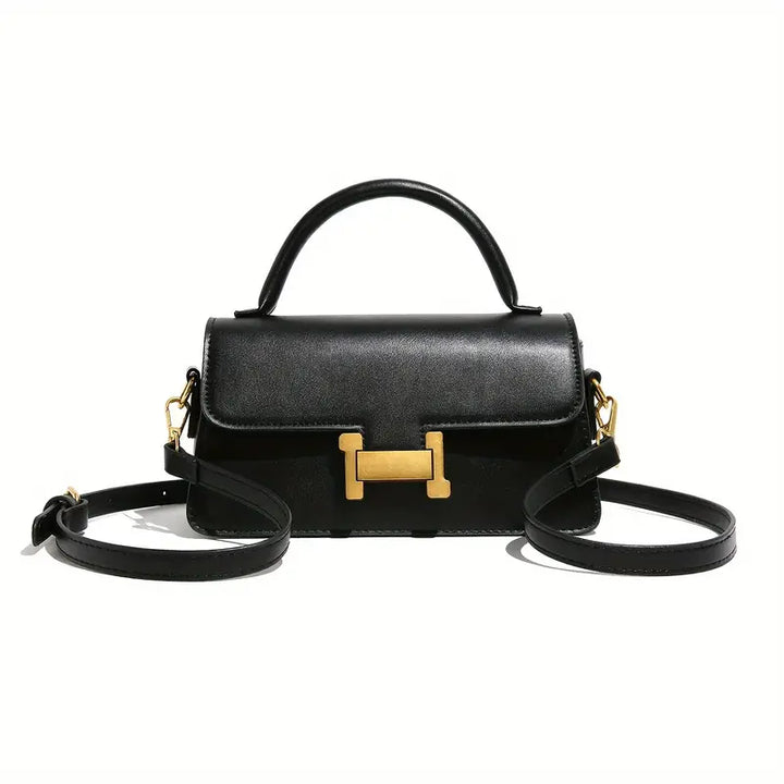 Borsa a tracolla nera in pelle con chiusura dorata a forma di H, manico superiore e tracolla regolabile. Elegante accessorio moda donna.