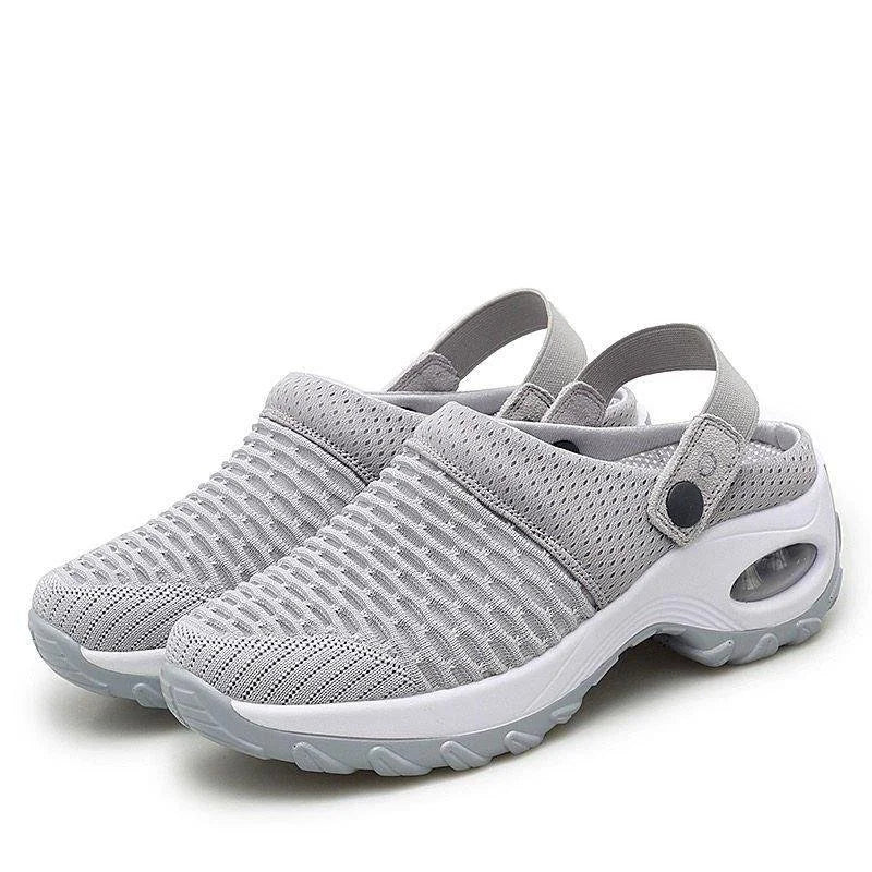 Scarpe da ginnastica grigie unisex, design traspirante con suola antiscivolo e cinturino regolabile. Ideali per sport e tempo libero.
