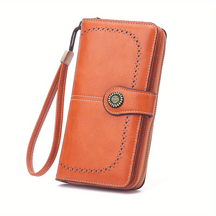Portafoglio donna in pelle arancione con cinturino, chiusura a bottone decorativa, design elegante e spazioso. Accessorio moda femminile.