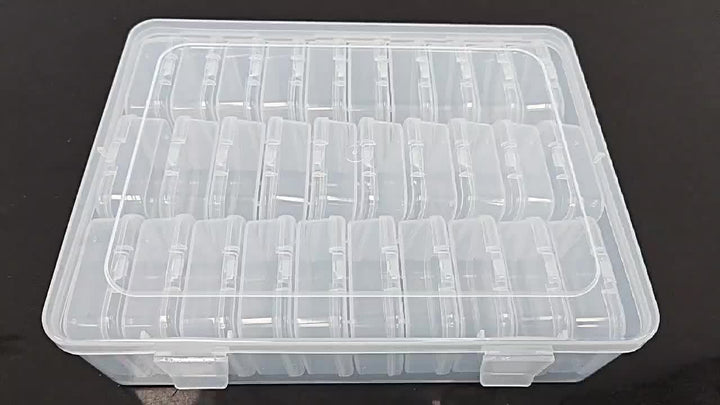 Scatola organizer trasparente in plastica con scomparti regolabili, ideale per conservare piccoli oggetti, accessori artigianali o minuteria.