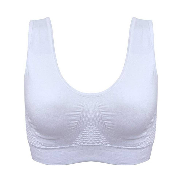 Reggiseno sportivo bianco senza cuciture, design a canotta, supporto confortevole, ideale per fitness e yoga. Materiale traspirante ed elastico.