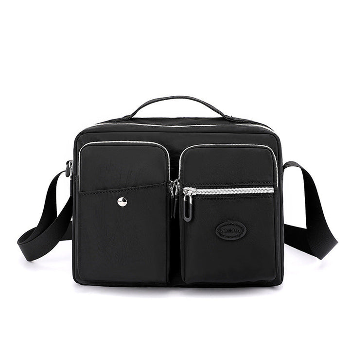 Borsa a tracolla nera unisex, design moderno, con tasche multiple e cerniere, ideale per lavoro e viaggio. Materiale resistente e impermeabile.