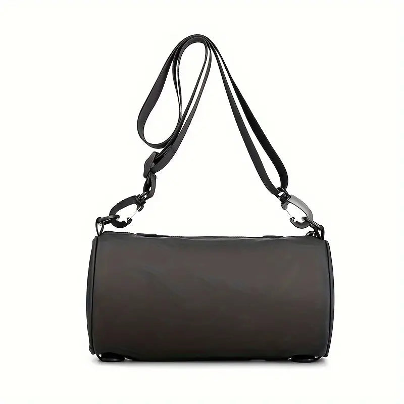 Borsa a tracolla nera in pelle, design cilindrico, con cinghia regolabile e dettagli metallici. Accessorio moda elegante e versatile.