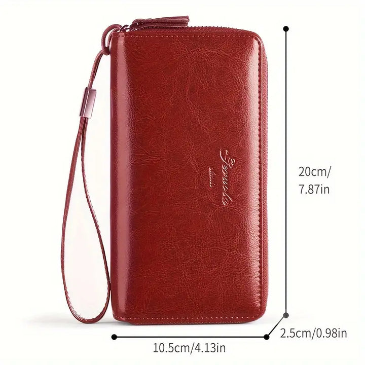 Portafoglio donna in pelle rossa con cerniera, cinturino da polso, dimensioni 20x10.5x2.5 cm. Elegante accessorio moda, pratico e spazioso.