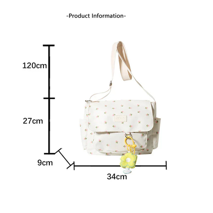 Zaino bianco con stampa floreale, dimensioni 34x27x9 cm, tracolla regolabile 120 cm, tasche laterali, ciondolo giallo. Accessorio moda donna.