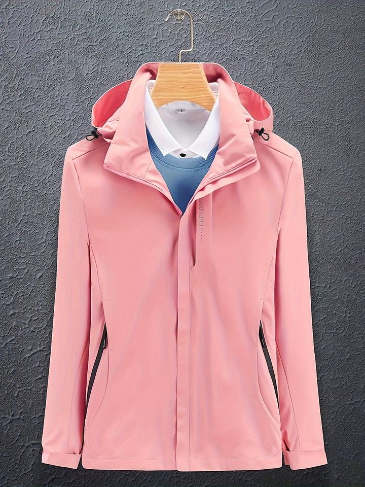 Giacca softshell rosa da donna con cappuccio, chiusura zip, su gruccia. Design elegante, ideale per outdoor e casual. Tessuto impermeabile.