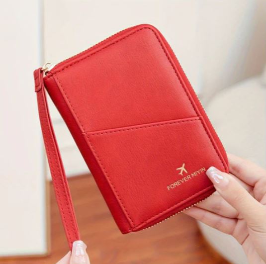 Portafoglio rosso in pelle con cerniera, design elegante e compatto, marchio "Forever Mynn", ideale per viaggi e uso quotidiano.
