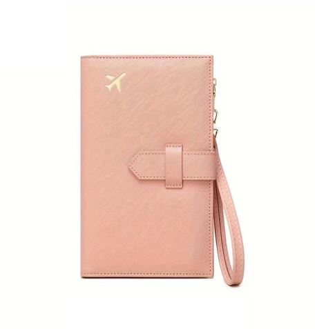 Portafoglio da viaggio rosa con cinturino, decorato con icona dorata di aereo. Accessorio elegante per organizzare documenti e carte.