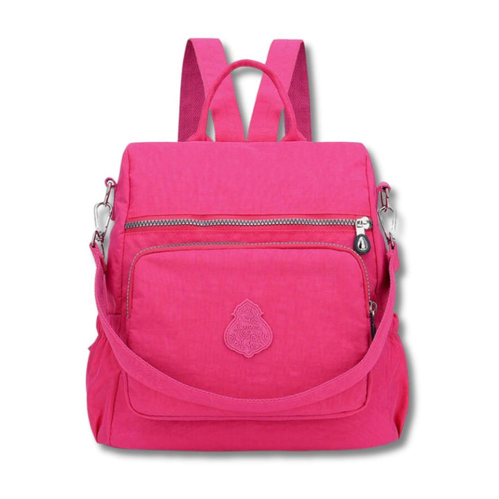 Zaino rosa donna, design moderno, tasche multiple con zip, spallacci regolabili, ideale per scuola e viaggio. Accessorio moda pratico e trendy.