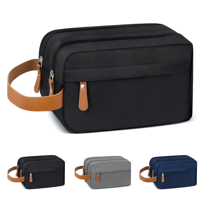 Borsa da toilette uomo in tessuto impermeabile nero con manico in pelle marrone, doppia cerniera. Disponibile in grigio, blu e nero.
