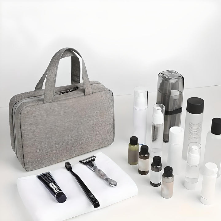 Borsa da viaggio grigia con manici, set da toilette incluso: spazzolino, rasoio, flaconi vari. Ideale per viaggi, organizzazione bagagli.