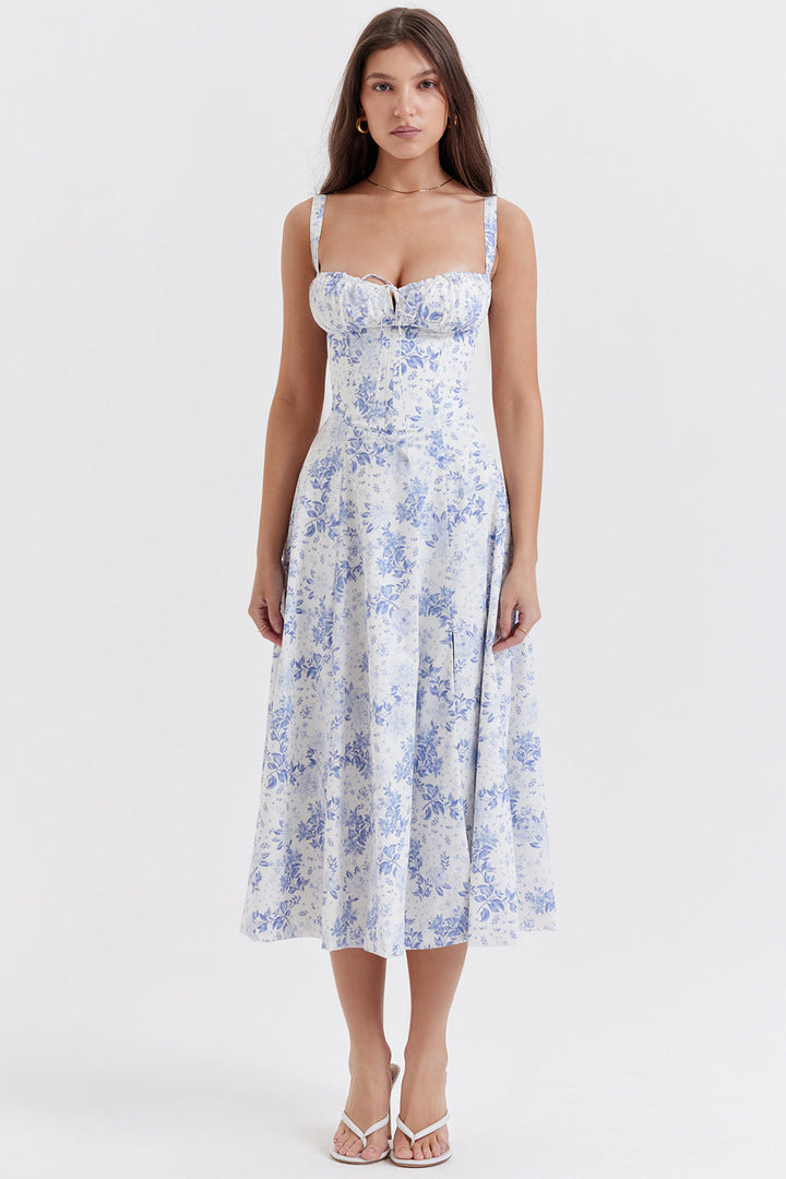 Abito estivo donna floreale bianco e blu, lunghezza midi, spalline sottili, scollo a cuore, perfetto per occasioni casual ed eleganti.