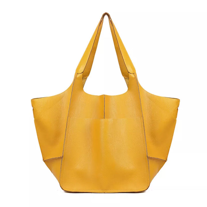 Borsa tote gialla in pelle sintetica, design moderno e spazioso, ideale per shopping e uso quotidiano. Accessorio moda donna elegante e pratico.
