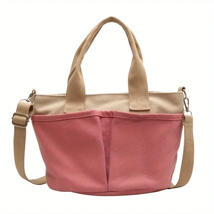 Borsa a tracolla in tela rosa con manici beige, design casual e pratico, ideale per shopping e uso quotidiano. Accessorio moda donna.