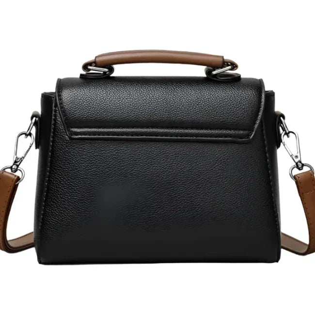 Borsa a tracolla in pelle nera con manico marrone, design elegante e moderno, ideale per donna, accessorio moda versatile e chic.