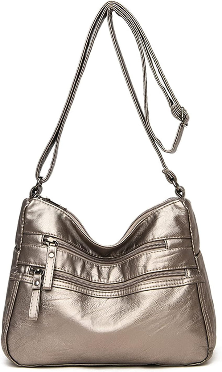 Borsa a tracolla in pelle sintetica color argento metallizzato con cerniere multiple, design elegante e moderno, ideale per donna.