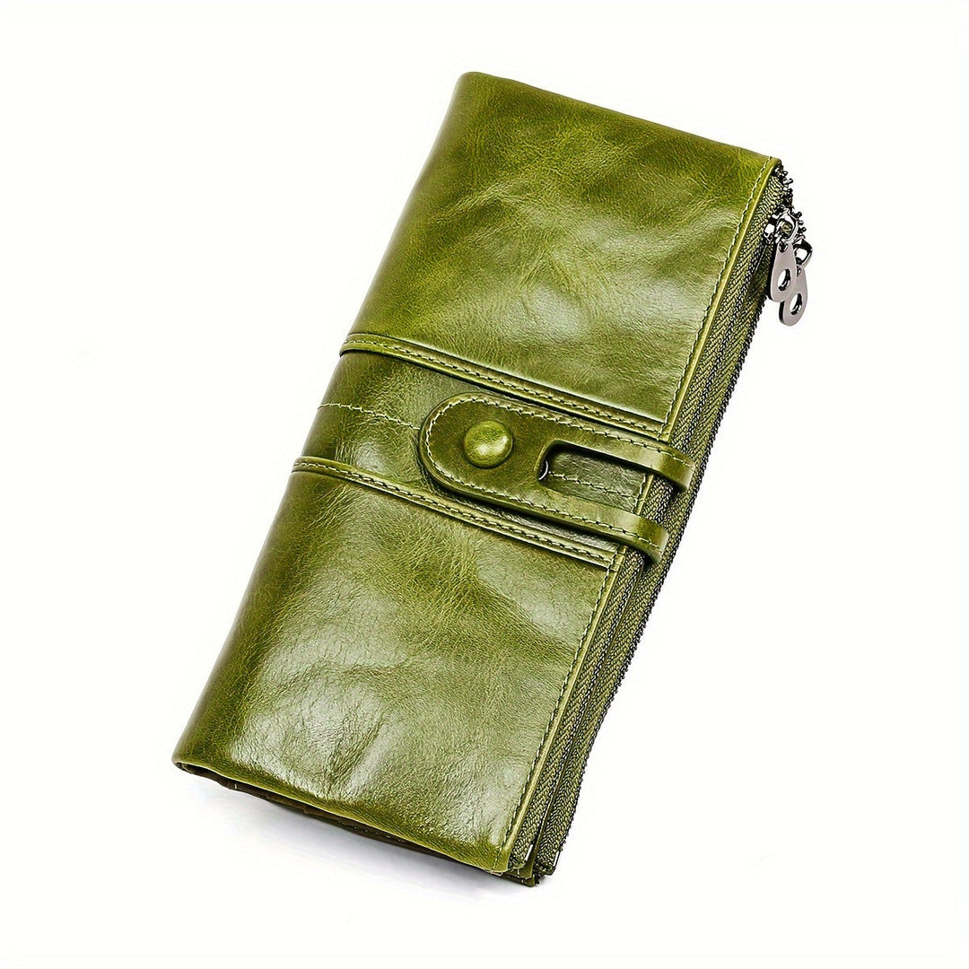 Portafoglio donna in pelle verde, design elegante con chiusura a bottone e zip laterale. Accessorio moda, alta qualità, stile contemporaneo.