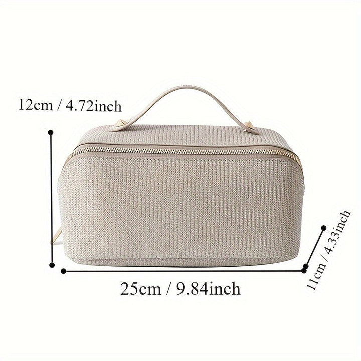 Borsa da toilette beige in tessuto, dimensioni 25x12x11 cm, con manico e cerniera dorata. Ideale per viaggi, organizer cosmetici.